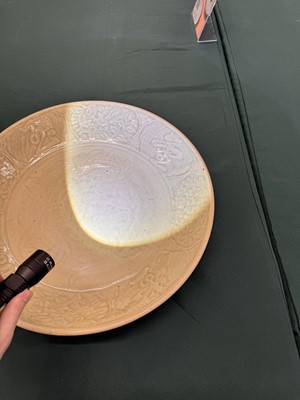 Lot 485 - A large Chinese Longquan celadon 'peony' charger, Ming Dynasty