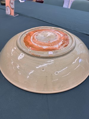 Lot 485 - A large Chinese Longquan celadon 'peony' charger, Ming Dynasty