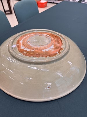Lot 485 - A large Chinese Longquan celadon 'peony' charger, Ming Dynasty