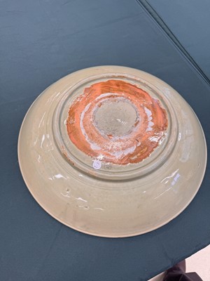 Lot 485 - A large Chinese Longquan celadon 'peony' charger, Ming Dynasty