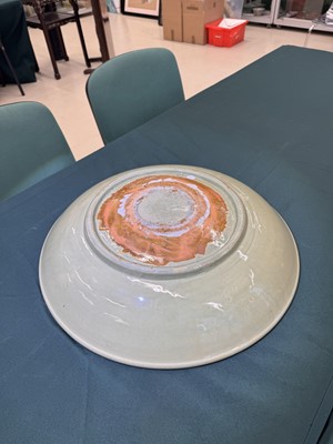 Lot 485 - A large Chinese Longquan celadon 'peony' charger, Ming Dynasty