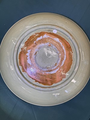 Lot 485 - A large Chinese Longquan celadon 'peony' charger, Ming Dynasty