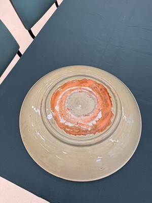 Lot 485 - A large Chinese Longquan celadon 'peony' charger, Ming Dynasty