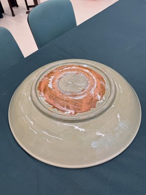 Lot 485 - A large Chinese Longquan celadon 'peony' charger, Ming Dynasty