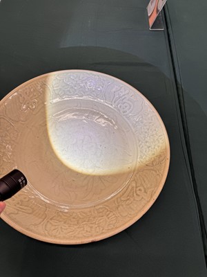 Lot 485 - A large Chinese Longquan celadon 'peony' charger, Ming Dynasty