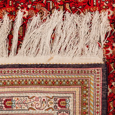 Lot 76 - An extremely fine silk Qum carpet, central Persia