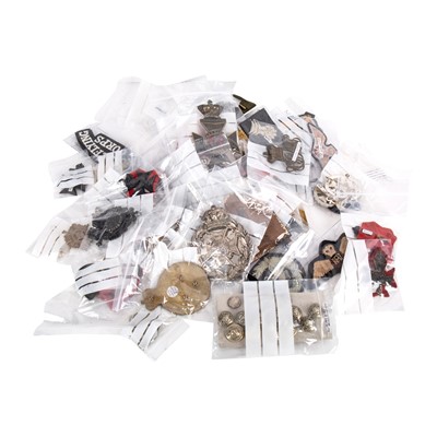 Lot 217 - A collection of British military cap badges and related insignia