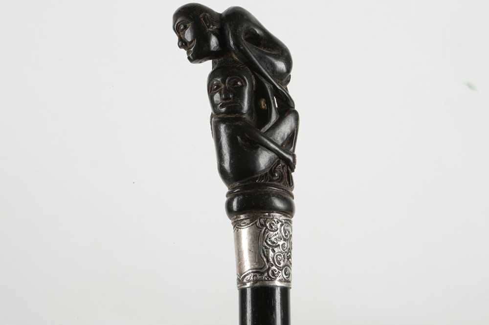 Lot 528 - AN AFRICAN EBONY NOVELTY WALKING STICK The...