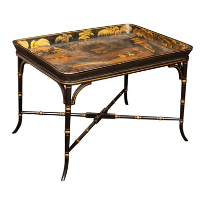 Lot 14 - A Chinoiserie decorated japanned tray on stand, 19th century