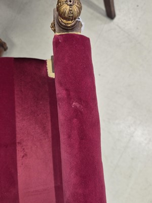 Lot 9 - A pair of French Empire walnut and parcel gilt X-frame stools