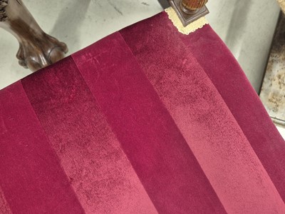 Lot 9 - A pair of French Empire walnut and parcel gilt X-frame stools