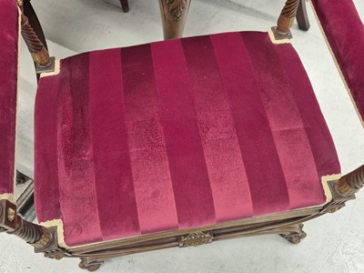 Lot 9 - A pair of French Empire walnut and parcel gilt X-frame stools