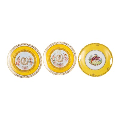 Lot 348 - A pair of Louis Philippe Sèvres 'Chateau des Tuileries' yellow ground plates, circa 1846