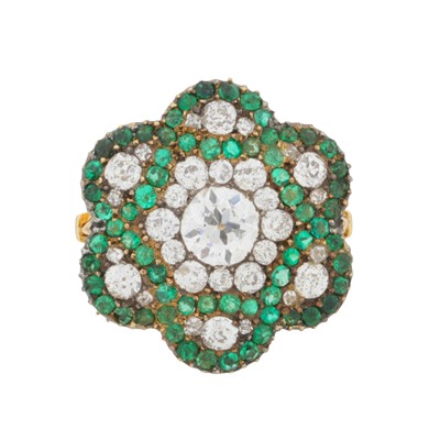 Lot 244 - An emerald and diamond flower ring