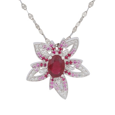 Lot 373 - A ruby, pink sapphire, and diamond flower pendant necklace