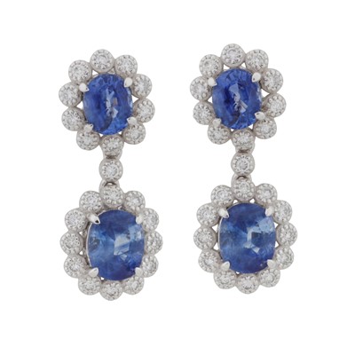 Lot 74 - A pair of sapphire and diamond pendent earrings