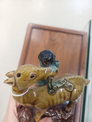 Lot 55 - A pair of Chinese sancai-glazed 'deer and lingzhi' figures, Qing dynasty, 19th century