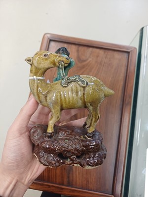 Lot 55 - A pair of Chinese sancai-glazed 'deer and lingzhi' figures, Qing dynasty, 19th century