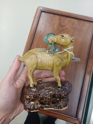 Lot 55 - A pair of Chinese sancai-glazed 'deer and lingzhi' figures, Qing dynasty, 19th century