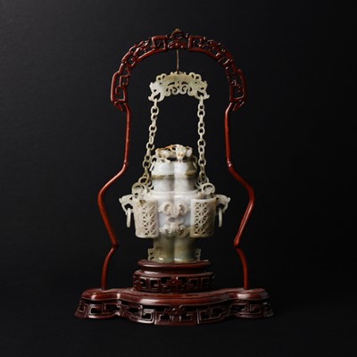 Lot 134 - A Chinese jade vase and cover with wood stand, 19th - 20th century