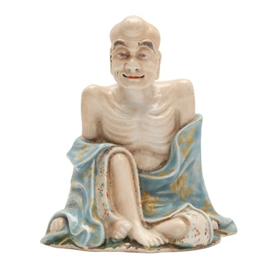 Lot 106 - A Chinese enamelled figure of Emaciated Luohan, Qing dynasty, 18th century