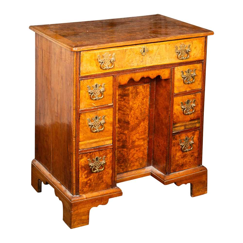 Lot 32 - A George II and later figured and burr walnut kneehole desk