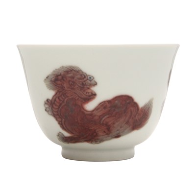 Lot 697 - A Chinese copper-red-decorated ‘lion’ cup, 20th century