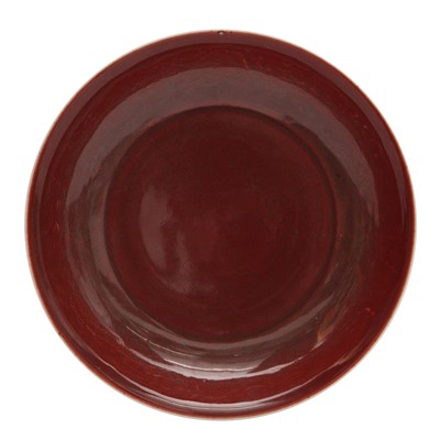 Lot 659 - A Chinese copper-red anhua and moulded dish, 20th century