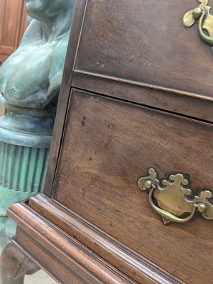 Lot 36 - A George II walnut chest on stand