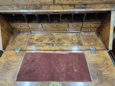 Lot 27 - An early 18th Century George I period walnut feather banded bureau bookcase