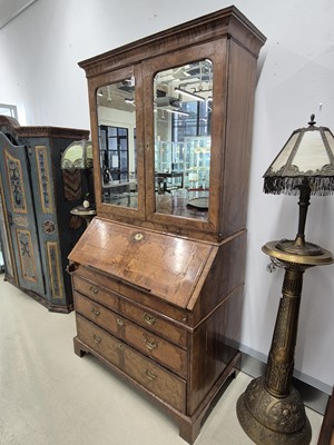 Lot 27 - An early 18th Century George I period walnut feather banded bureau bookcase