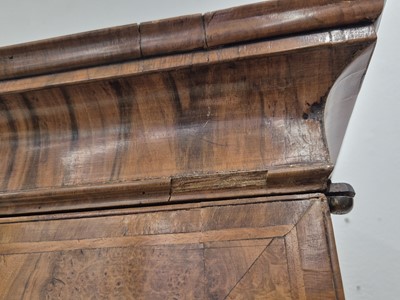 Lot 27 - An early 18th Century George I period walnut feather banded bureau bookcase
