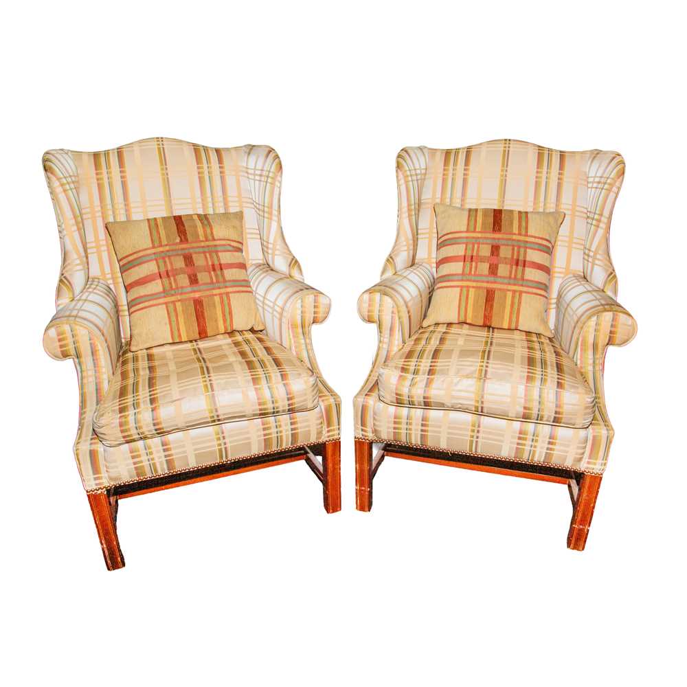 Lot 59 - A pair of George III style wingback armchairs