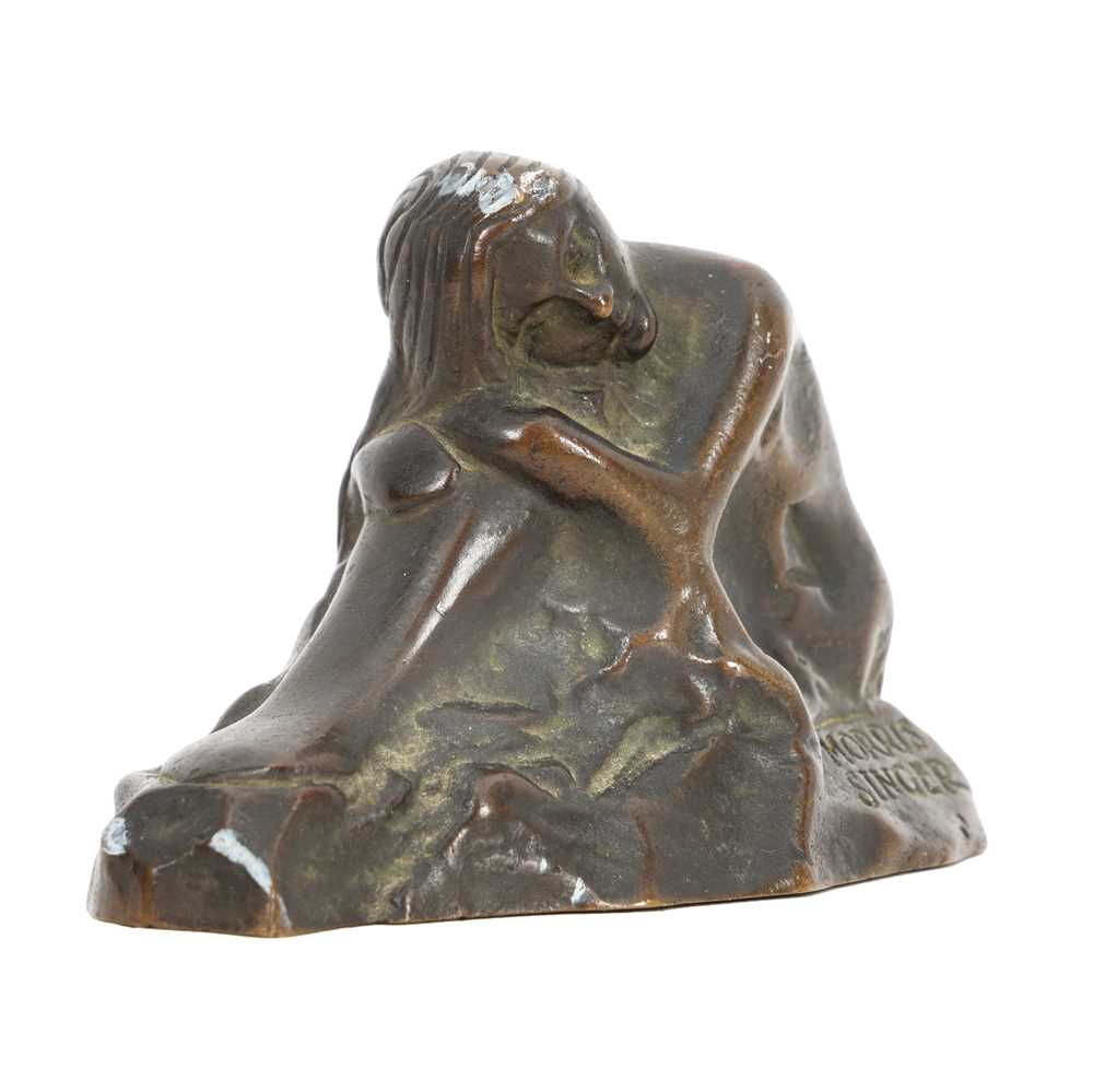 Lot 75 - A patinated bronze model of a crouching female nude