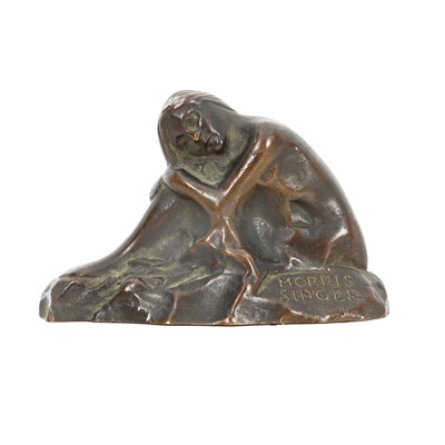 Lot 75 - A patinated bronze model of a crouching female nude