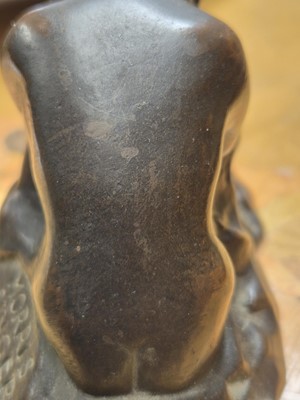 Lot 75 - A patinated bronze model of a crouching female nude
