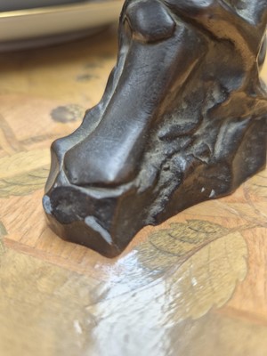 Lot 75 - A patinated bronze model of a crouching female nude
