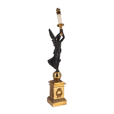 Lot 69 - A French Empire style gilt and patinated bronze figural table lamp, early 20th century