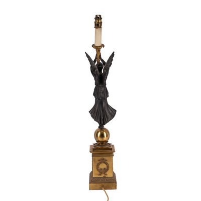 Lot 69 - A French Empire style gilt and patinated bronze figural table lamp, early 20th century