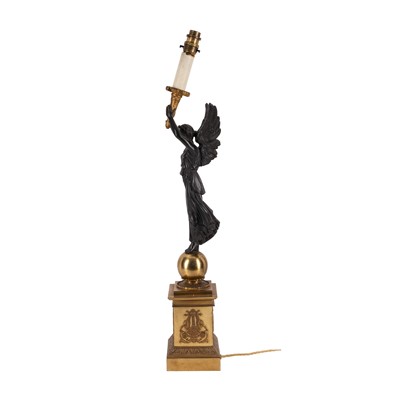 Lot 69 - A French Empire style gilt and patinated bronze figural table lamp, early 20th century