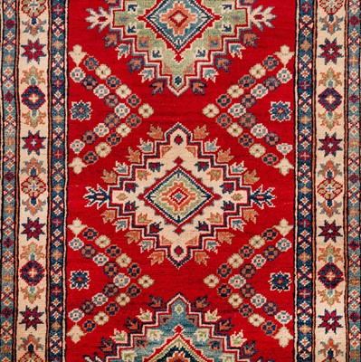 Lot 63 - A fine Kazak design runner