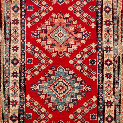 Lot 63 - A fine Kazak design runner