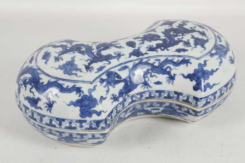 Lot 541 - A Chinese blue and white 'dragons' cash-shaped...