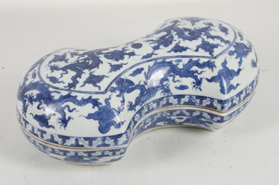 Lot 541 - A Chinese blue and white 'dragons' cash-shaped...