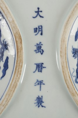 Lot 541 - A Chinese blue and white 'dragons' cash-shaped...