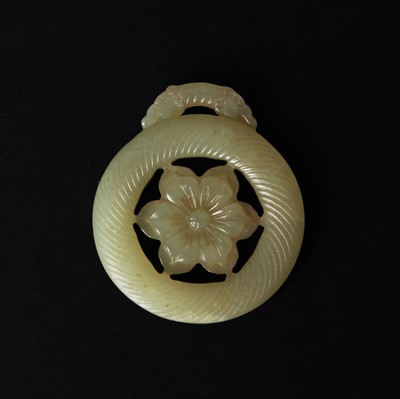 Lot 125 - A Chinese jade 'flower' pendant, 19th - 20th century