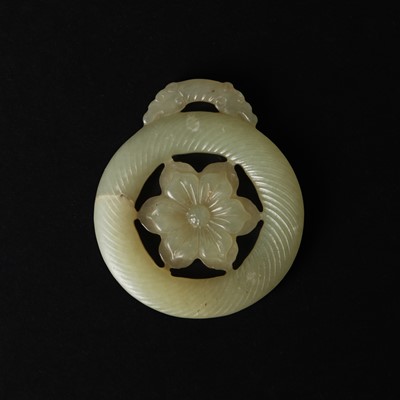 Lot 510 - A Chinese jade 'flower' pendant, 19th - 20th century