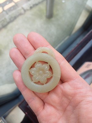Lot 510 - A Chinese jade 'flower' pendant, 19th - 20th century