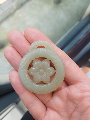 Lot 510 - A Chinese jade 'flower' pendant, 19th - 20th century