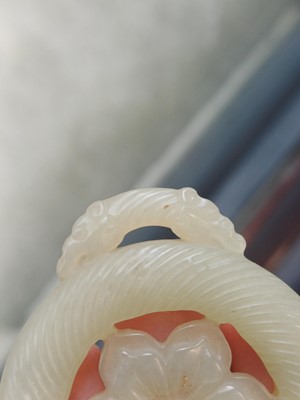 Lot 510 - A Chinese jade 'flower' pendant, 19th - 20th century